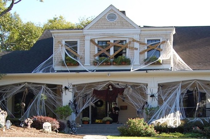 cute-outdoor-halloween-decorations-wooden-siding-gray-roof-exterior-decor